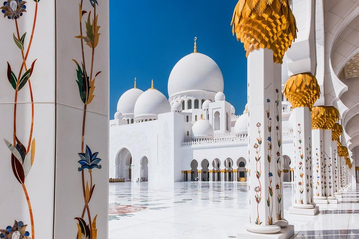 Discover the stunning beauty of Sheikh Zayed Grand Mosque where intricate architecture meets serene surroundings inviting travelers to immerse themselves in Abu Dhabi's rich cultural heritage.